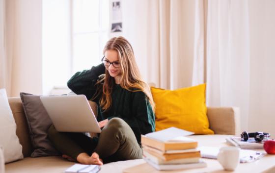 student working on her laptop